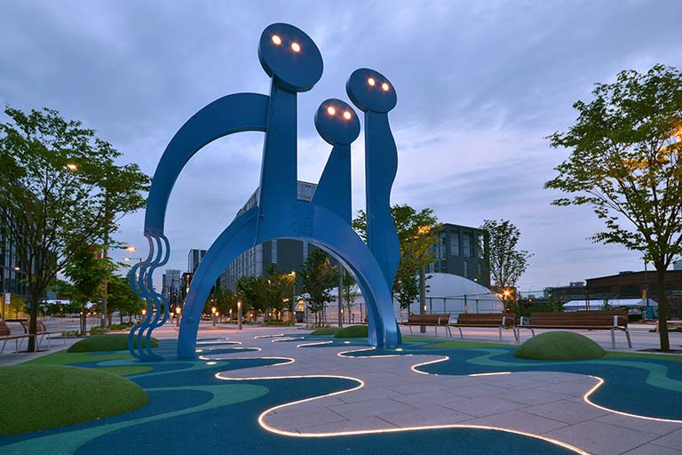 Installation of large blue abstract figures in Corktown