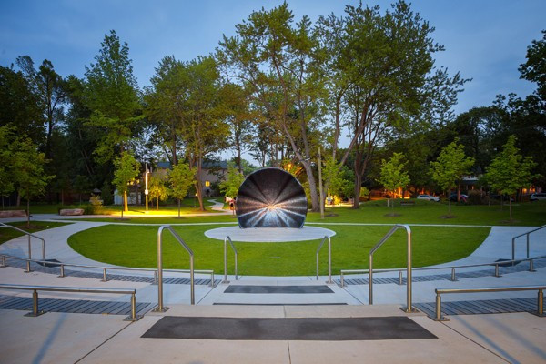 A bandshell illuminated from the centre.