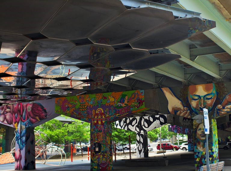 Murals at Underpass Park by multiple artist in different styles.