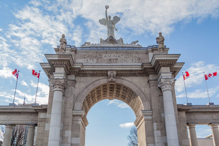The Prince's Gate against a cloud filled sky