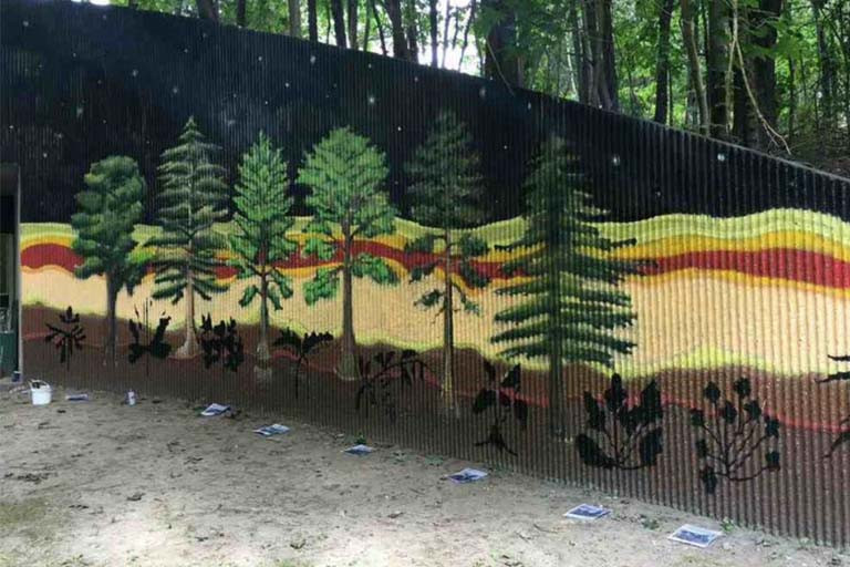 A mural of different types of trees.