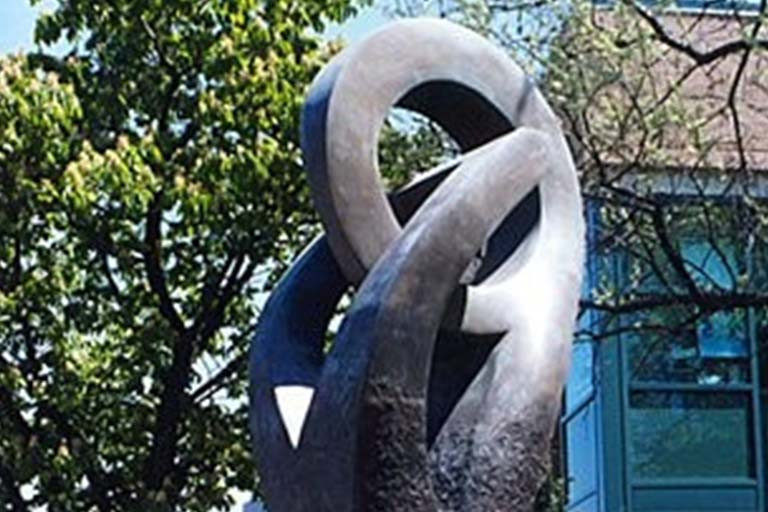 Installation of an abstract shape on stone plinth