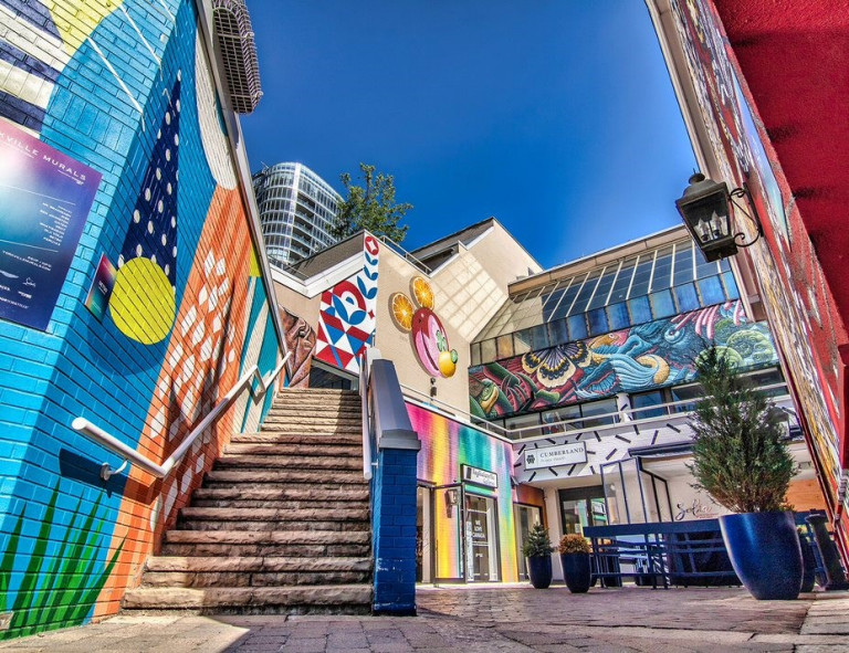 Colourful murals in a courtyard at 99 Yorkville Ave