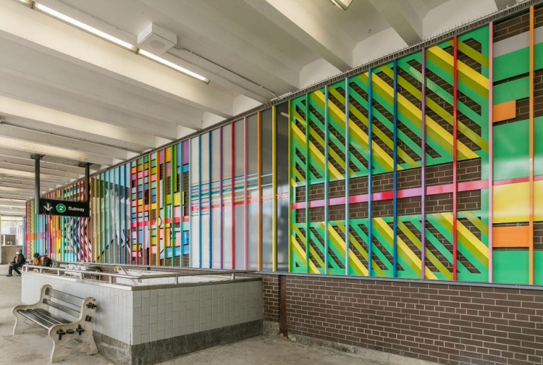 Colourful mural comprised of lines, located in a TTC station